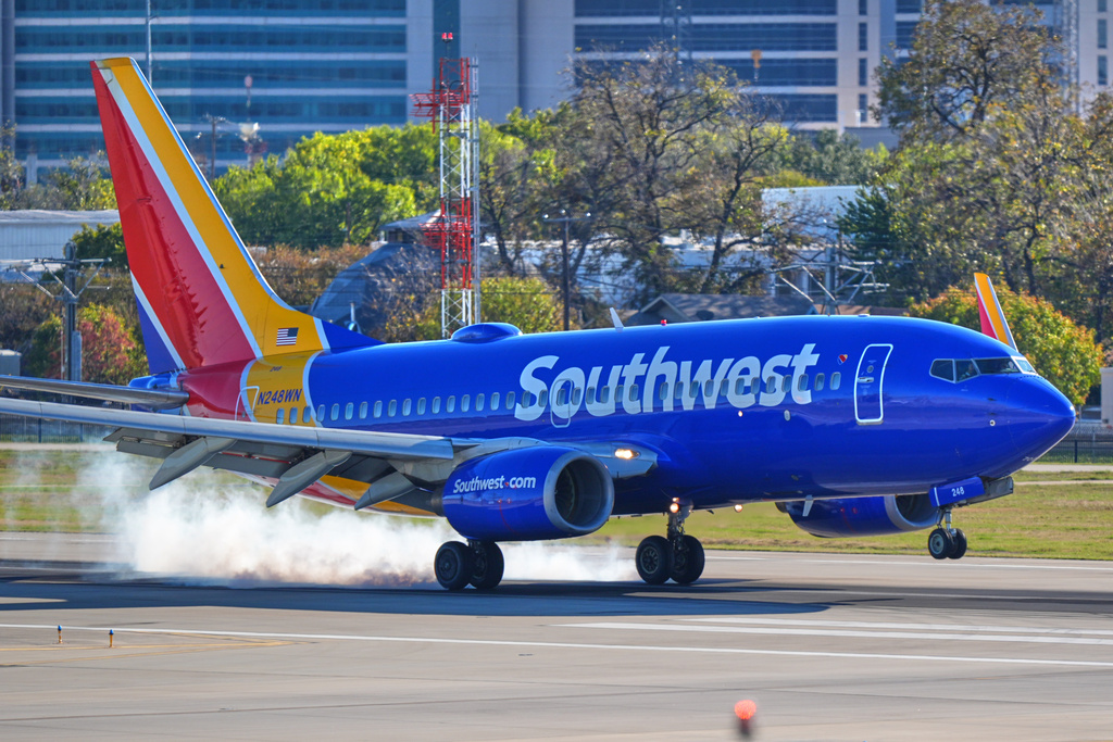 FILE - A Southwest Airlines plane lands at Love Field Airport, Nov. 26, 2025, in Dallas. (AP Photo/LM Otero, File)