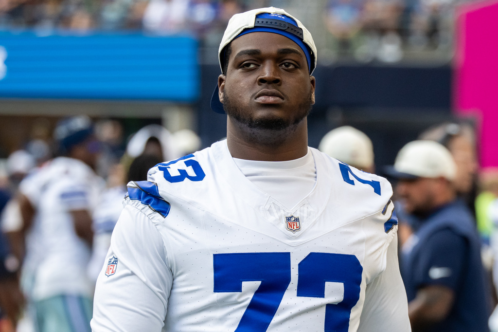 FILE - Dallas Cowboys offensive lineman Tyler Smith stands on the sideline during an NFL preseason football game against the Seattle Seahawks, Aug. 15, 2026, in Seattle. (AP Photo/Stephen Brashear, File)