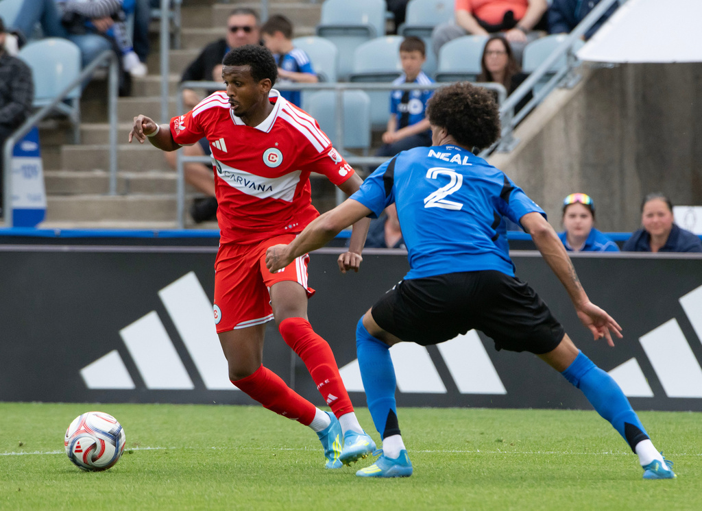 Chicago Fire FC's Maren Haile-Selassie tries to take the ball around CF Montreal's Jalen Neal (2) during the first half of an MLS soccer game in Montreal, Saturday May 16, 2026. (Peter McCabe/The Canadian Press via AP)