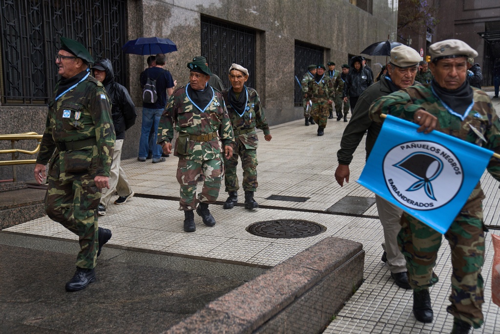 Retired military personnel gather to call for the release of former servicemen accused of human rights violations during the last dictatorship, in Buenos Aires, Argentina, Saturday, Nov. 29, 2025. (AP Photo/Rodrigo Abd)