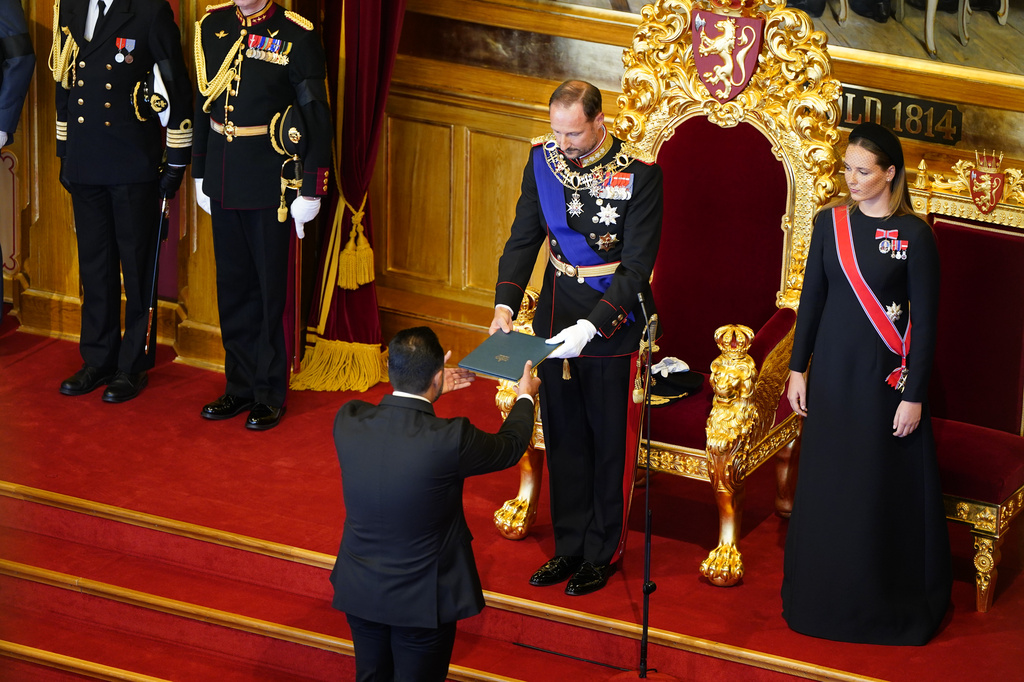 King Haakon VIII. takes the oath according to the Constitution in the Storting, Norway's parliament, accompanied by Crown Princess Ingrid Alexandra, right, in Oslo, Norway, Tuesday, Sept. 1, 2026. (Hakon Mosvold Larsen/Pool Photo via AP)