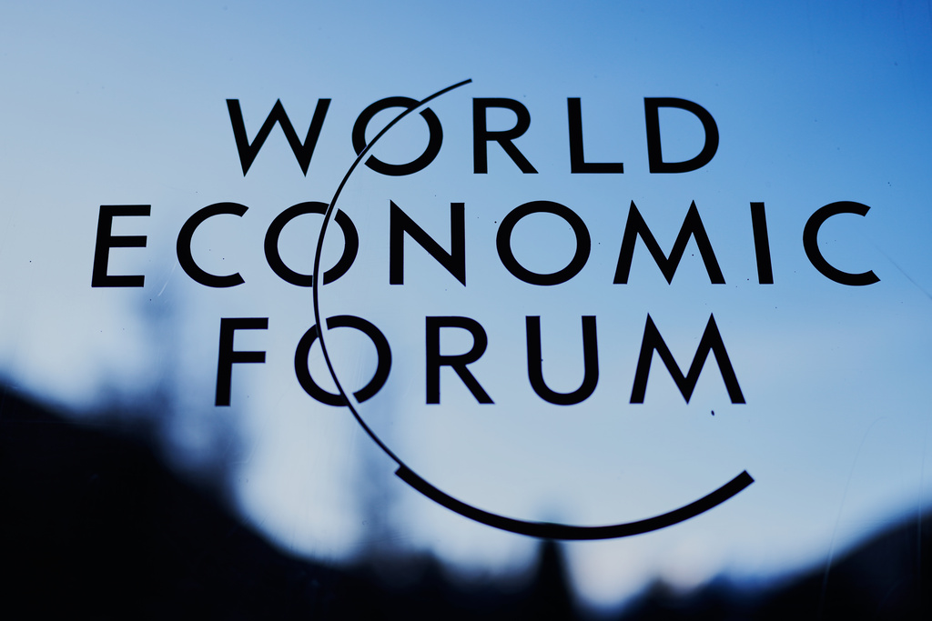 The logo of the World Economy Forum is displayed on a window of the Congress Center where the Annual Meeting Forum take place in Davos, Switzerland, Monday, Jan. 19, 2026. (AP Photo/Markus Schreiber)