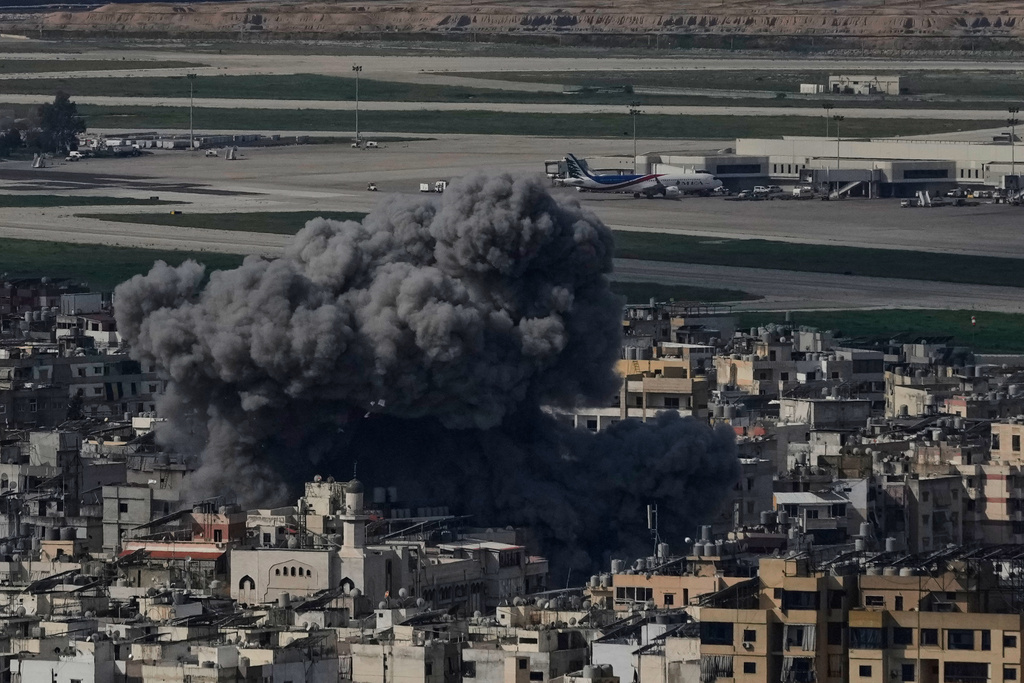 Smoke rises following an Israeli airstrike in Dahiyeh, Beirut's southern suburb, near Rafik Hariri International Airport, Lebanon, Wednesday, March 4, 2026. (AP Photo/Bilal Hussein)