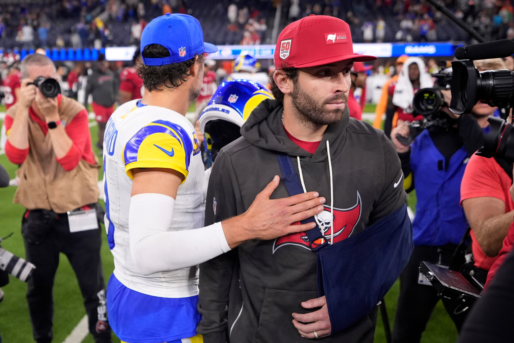 Los Angeles Rams quarterback Matthew Stafford (9) greets Tampa Bay Buccaneers quarterback Baker Mayfield (6) after an NFL football game Sunday, Nov. 23, 2025, in Inglewood, Calif. (AP Photo/Mark J. Terrill)