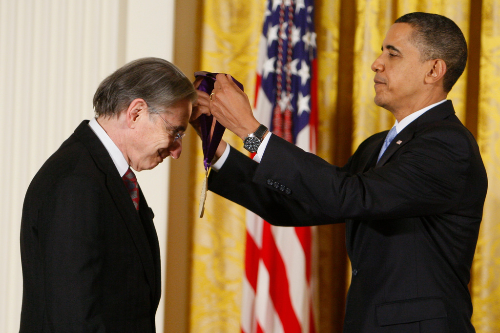 FILE - President Barack Obama presents conductor Michael Tilson Thomas the 2009 National Medal of Arts in the East Room of the White House in Washington on Feb. 25, 2010. (AP Photo/Charles Dharapak, File)