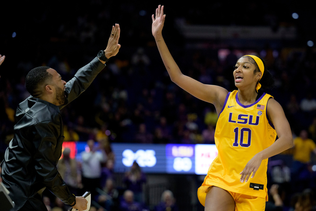 FILE - LSU assistant coach Gary Redus II celebrates with LSU guard Angel Reese (10) in the second half of an NCAA college basketball game against Auburn, Jan. 15, 2023, in Baton Rouge, La. (AP Photo/Matthew Hinton, file)