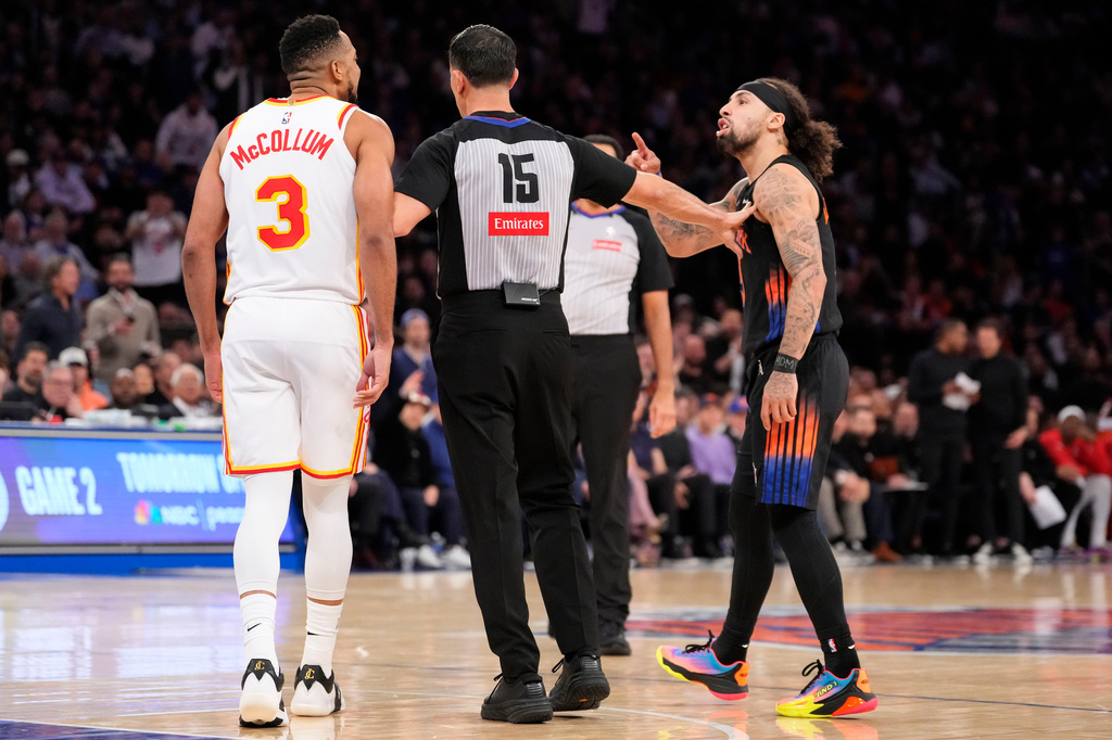 New York Knicks guard Jose Alvarado, right, argues with Atlanta Hawks guard CJ McCollum (3) during the second half in Game 2 of a first-round NBA playoffs basketball series, Monday, April 20, 2026, in New York. (AP Photo/Yuki Iwamura)