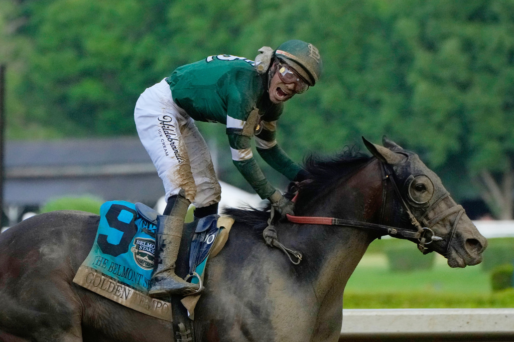 Jockey Jose Ortiz celebrates as he crosses the finish line aboard Golden Tempo (9) to win the 158th running of the Belmont Stakes horse race, Saturday, June 6, 2026, in Saratoga Springs, N.Y. (AP Photo/Yuki Iwamura)