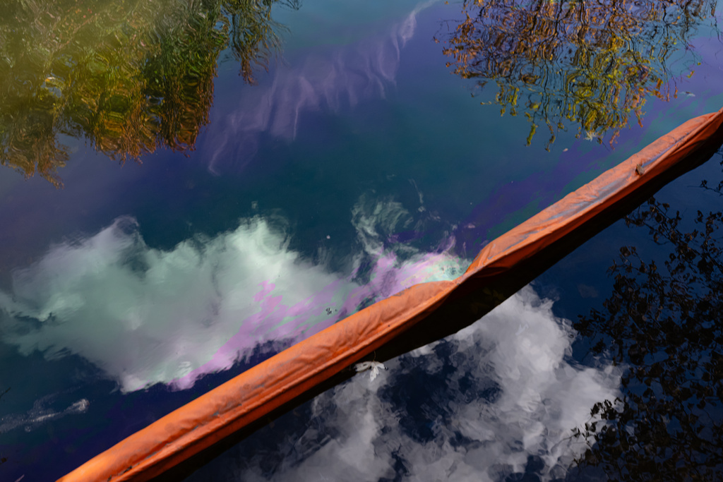 Oil runoff from the UPS plane crash is seen in a waterway known as Northern Ditch, Saturday, Nov. 8, 2025, in Louisville, Ky. (AP Photo/Jon Cherry)