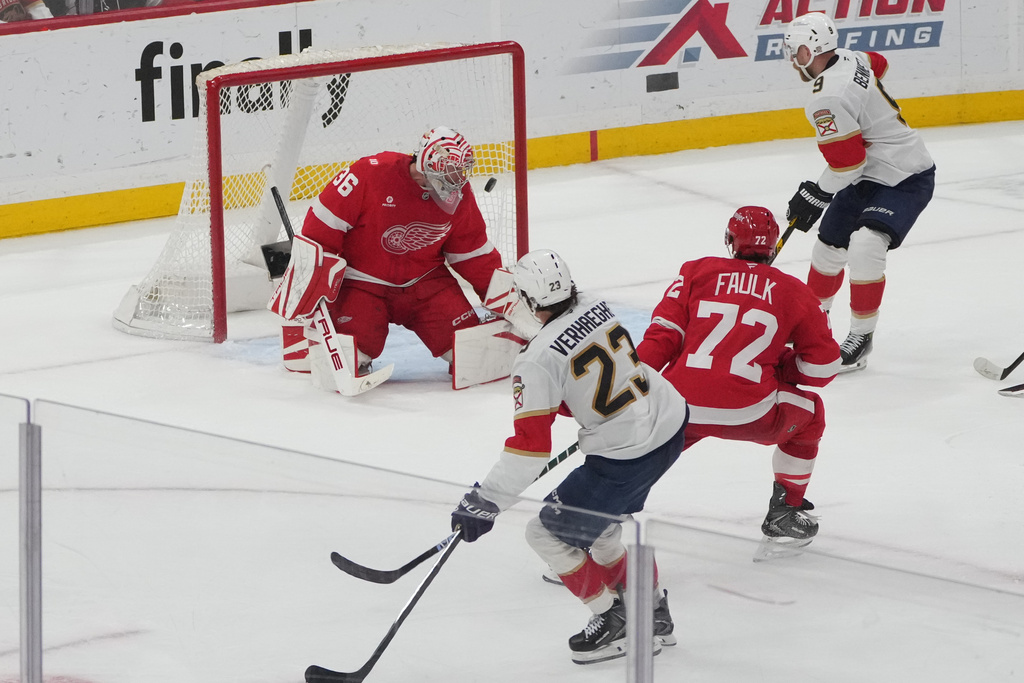Florida Panthers center Carter Verhaeghe (23) scores a goal against Detroit Red Wings goaltender John Gibson (36) during the third period of an NHL hockey game, Tuesday, March 10, 2026, in Sunrise, Fla. (AP Photo/Marta Lavandier)