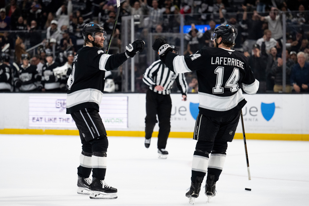 Los Angeles Kings right wing Adrian Kempe, left, and right wing Alex Laferriere celebrate a goal by Kempe during the second period of an NHL hockey game against the St. Louis Blues, Wednesday, April 1, 2026, in Los Angeles. (AP Photo/Kyusung Gong)