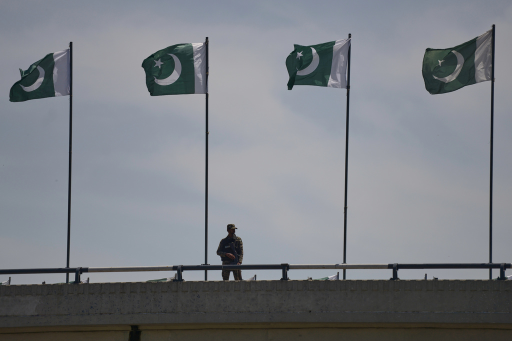 A soldier stands guard on a bridge ahead of second round of negotiations between the U.S. and Iran, in Islamabad, Pakistan, Monday, April 20, 2026. (AP Photo/M.A. Sheikh)