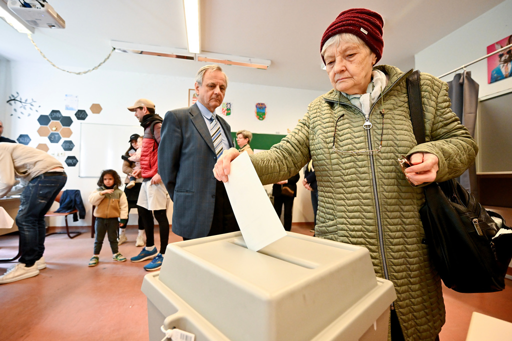 A woman casts her ballot at a polling station during the Hungarian parliamentary election in Budapest, Hungary, Sunday, April 12, 2026. (AP Photo/Denes Erdos)
