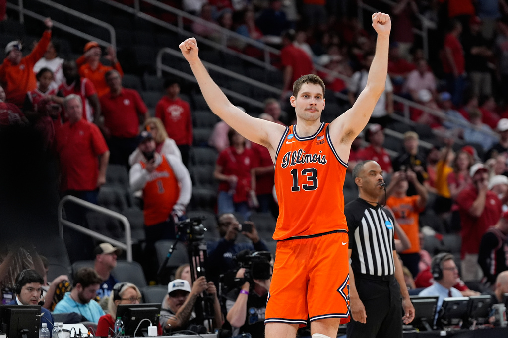 Illinois center Tomislav Ivisic (13) reacts after defeating Houston in the Sweet 16 of the NCAA college basketball tournament Friday, March 27, 2026, in Houston. (AP Photo/Ashley Landis)