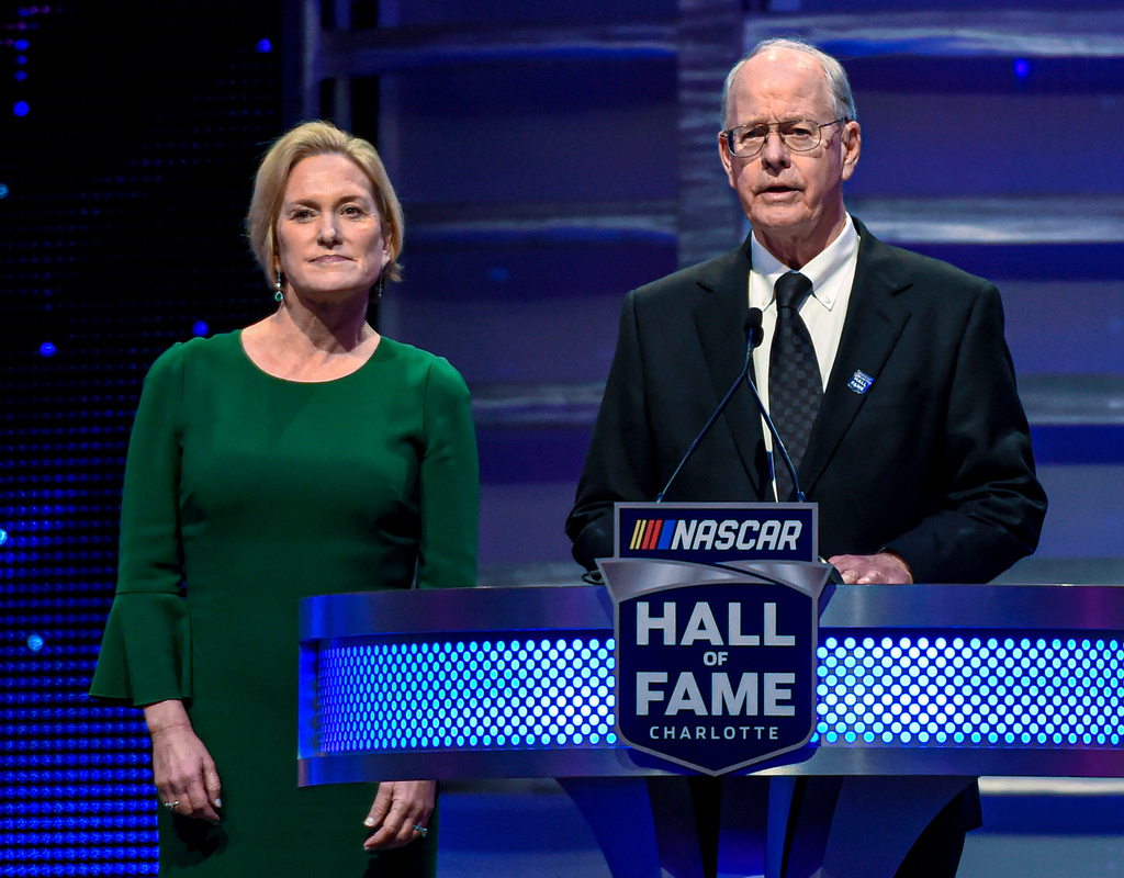 FILE - NASCAR CEO Jim France, right, along with the Executive Vice President of NASCAR Lesa France Kennedy announce the Landmark Award to Edsel Ford II at Hall of Fame induction ceremonies in Charlotte, N.C. Jan. 31, 2020. (AP Photo/Mike McCarn, File)