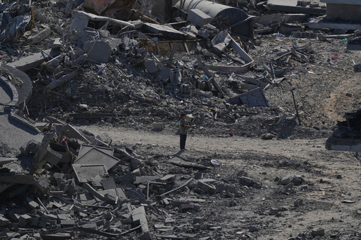 A Palestinian boy stands amid destroyed buildings in Gaza City, Saturday, Oct. 11, 2025, after Israel and Hamas agreed to a pause in their war and the release of the remaining hostages. (AP Photo/Abdel Kareem Hana) A Palestinian boy stands amid destroyed buildings in Gaza City, Saturday, Oct. 11, 2025, after Israel and Hamas agreed to a pause in their war and the release of the remaining hostages. (AP Photo/Abdel Kareem Hana)