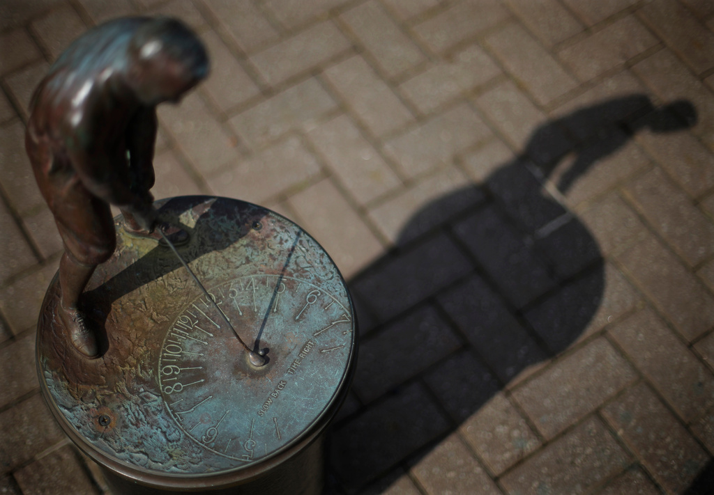 FILE - A sundial of golfer Bobby Jones sits outside the Augusta National Golf Club house during a practice round for the Masters golf tournament April 9, 2013, in Augusta, Ga. (AP Photo/David Goldman, File)