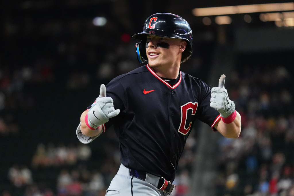 Cleveland Guardians' Travis Bazzana gestures while running the bases after hitting a home run during the first inning of a baseball game against the Texas Rangers, Friday, June 5, 2026, in Arlington, Texas. (AP Photo/LM Otero)