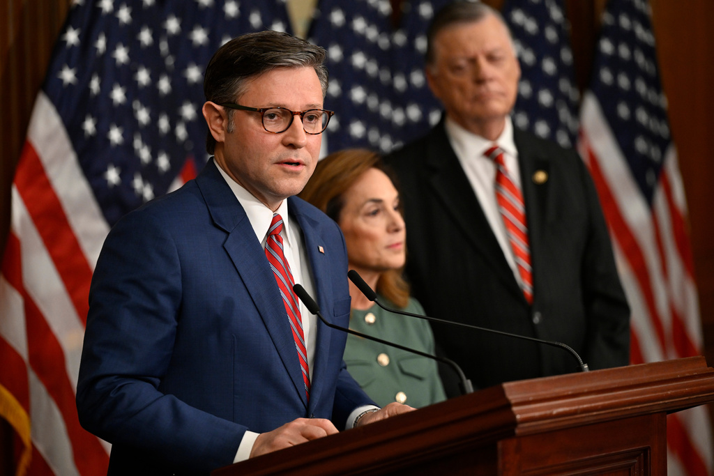 Speaker of the House Mike Johnson, R-La., left, addresses the media asHouse Republican Conference Chairwoman Lisa McClain, R-Mich., and House Committee on Appropriations Chairman Tom Cole, R-Okla., listen during a press conference on the 8th day of the government shutdown at the U.S. Capitol on Wednesday, Oct. 8, 2025, in Washington. (AP Photo/John McDonnell)
