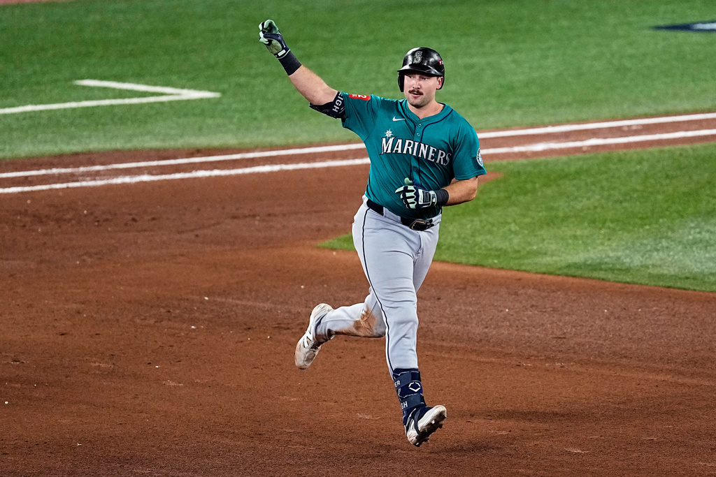 Seattle Mariners' Cal Raleigh celebrates his solo home run as he rounds the bases against the Toronto Blue Jays during the sixth inning in Game 1 of baseball's American League Championship Series, Sunday, Oct. 12, 2025, in Toronto. (AP Photo/David J. Phillip)