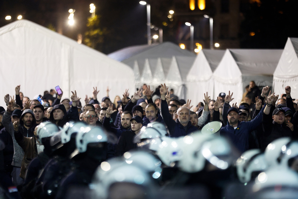 Loyalists of autocratic President Aleksandar Vucic shout slogans during protest in front of the parliament building, in Belgrade, Serbia, Sunday, Nov. 2, 2025. (AP Photo/Marko Drobnjakovic)
