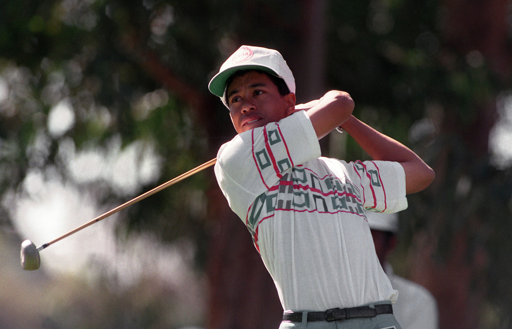 FILE - Amateur golfer Tiger Woods tees off at the 11th hole during the pro-m for the Los Angeles Open golf tournament at Riviera Country Club in Los Angeles, Feb. 26, 1992. (AP Photo/Bob Galbraith, File)