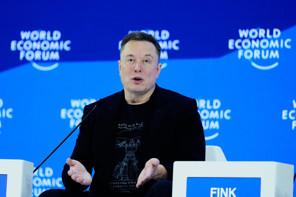 Elon Musk attends the Annual Meeting of the World Economic Forum in Davos, Switzerland, Thursday, Jan. 22, 2026. (AP Photo/Markus Schreiber)