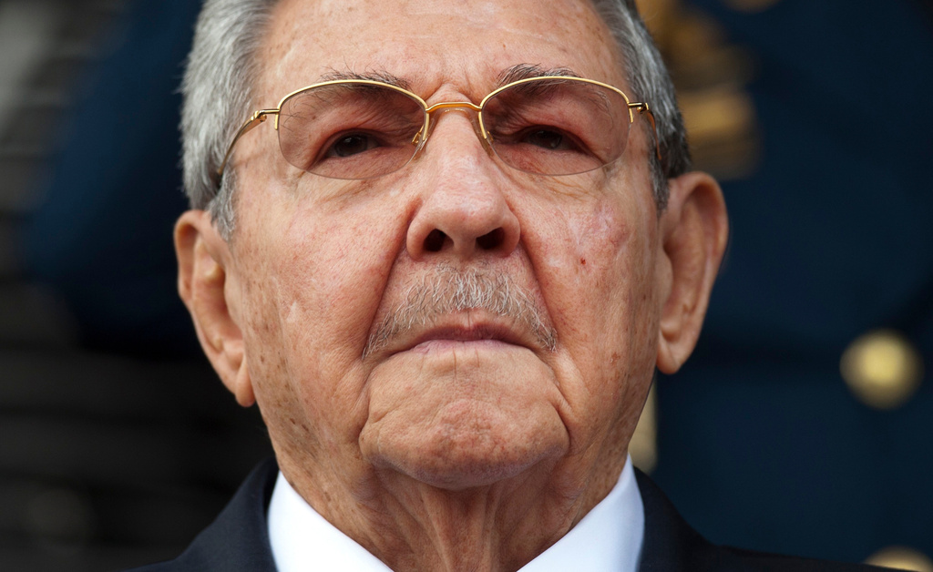 FILE - Cuba's President Raul Castro listens to the Cuban and Venezuelan national anthems during his welcome ceremony at the Miraflores presidential palace, March 17, 2015, in Caracas, Venezuela. (AP Photo/Ariana Cubillos, File)