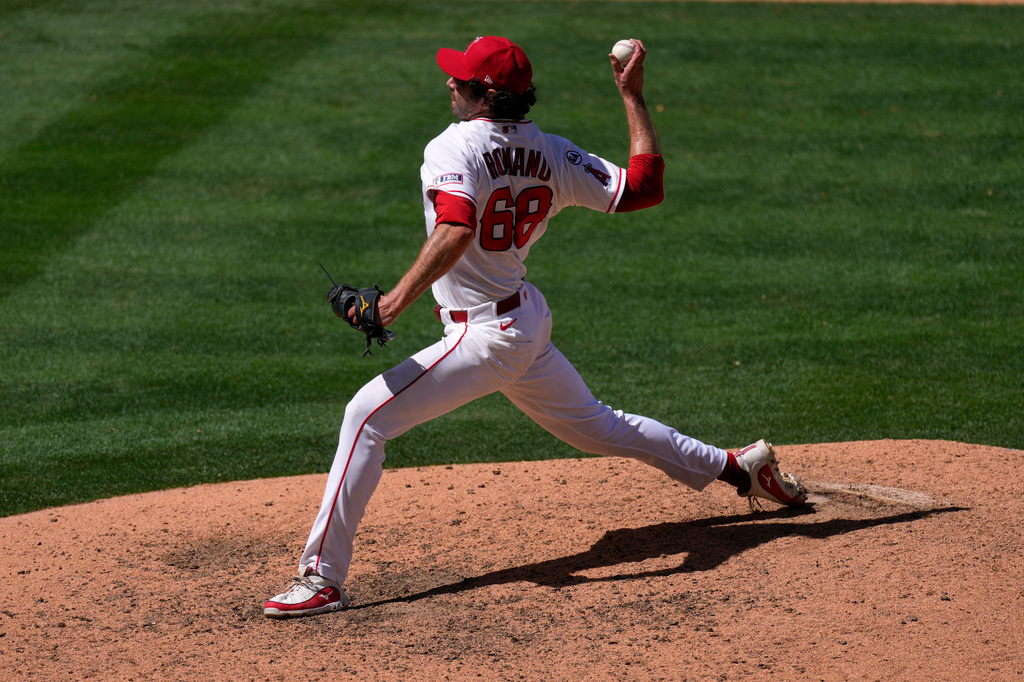 Los Angeles Angels relief pitcher Jordan Romano throws to the plate during the ninth inning of a baseball game against the Toronto Blue Jays, Wednesday, April 22, 2026, in Anaheim, Calif. (AP Photo/Mark J. Terrill)