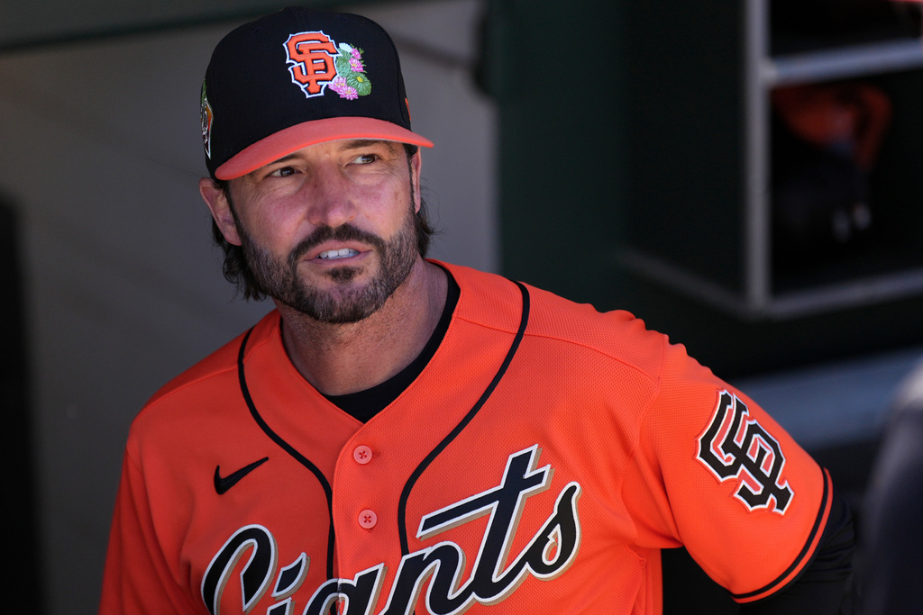 San Francisco Giants manager Tony Vitello pauses in the team dugout prior to a spring training baseball game against the Cincinnati Reds Friday, March 6, 2026, in Scottsdale, Ariz. (AP Photo/Ross D. Franklin)