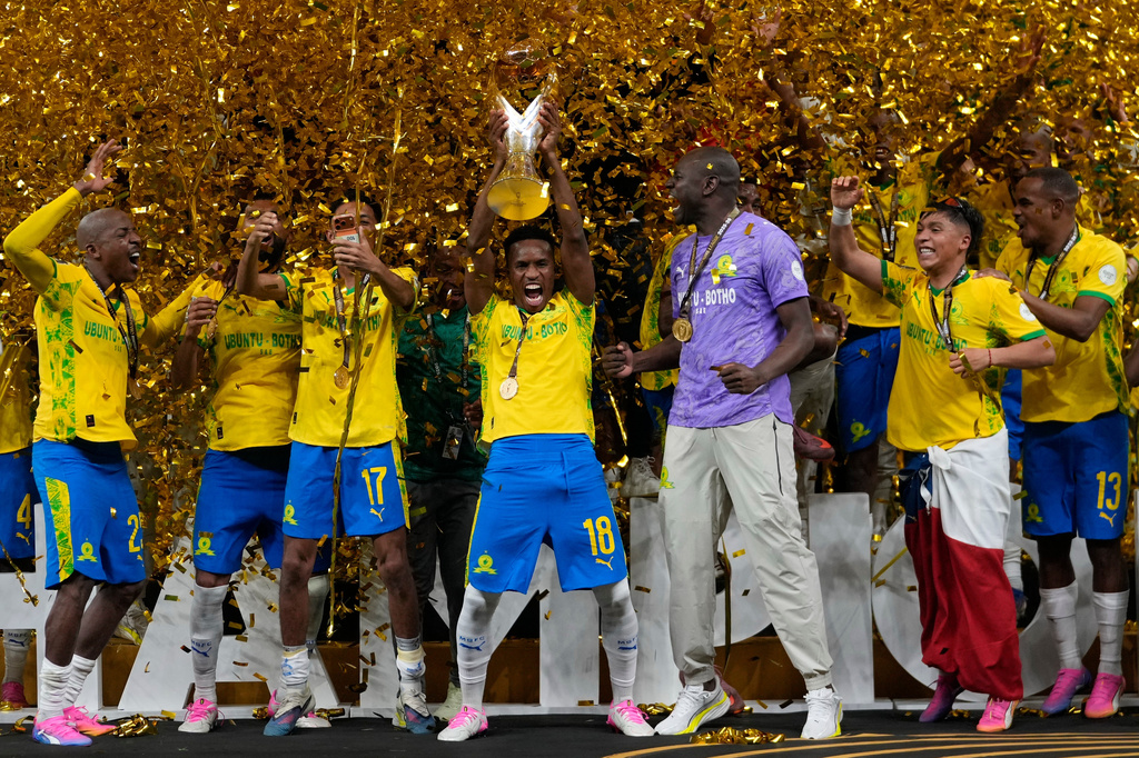 Mamelodi Sundowns' Themba Zwane, center, celebrates with his teammates after winning the CAF Champions League final soccer match between AS FAR Rabat and Mamelodi Sundowns, in Rabat, Morocco, Sunday, May 24, 2026. (AP Photo/Mosa'ab Elshamy)