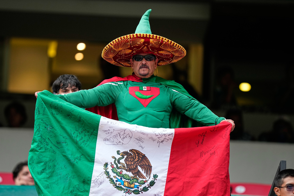 Fans react ahead of the World Cup Group A soccer match between Czechia and Mexico in Mexico City, Wednesday, June 24, 2026. (AP Photo/Fernando Llano)