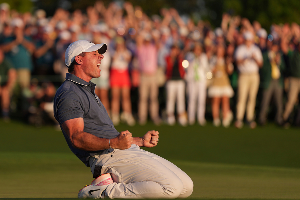 FILE - Rory McIlroy, of Northern Ireland, reacts after winning in a playoff against Justin Rose after the final round at the Masters golf tournament, Sunday, April 13, 2025, in Augusta, Ga. (AP Photo/Matt Slocum, File)