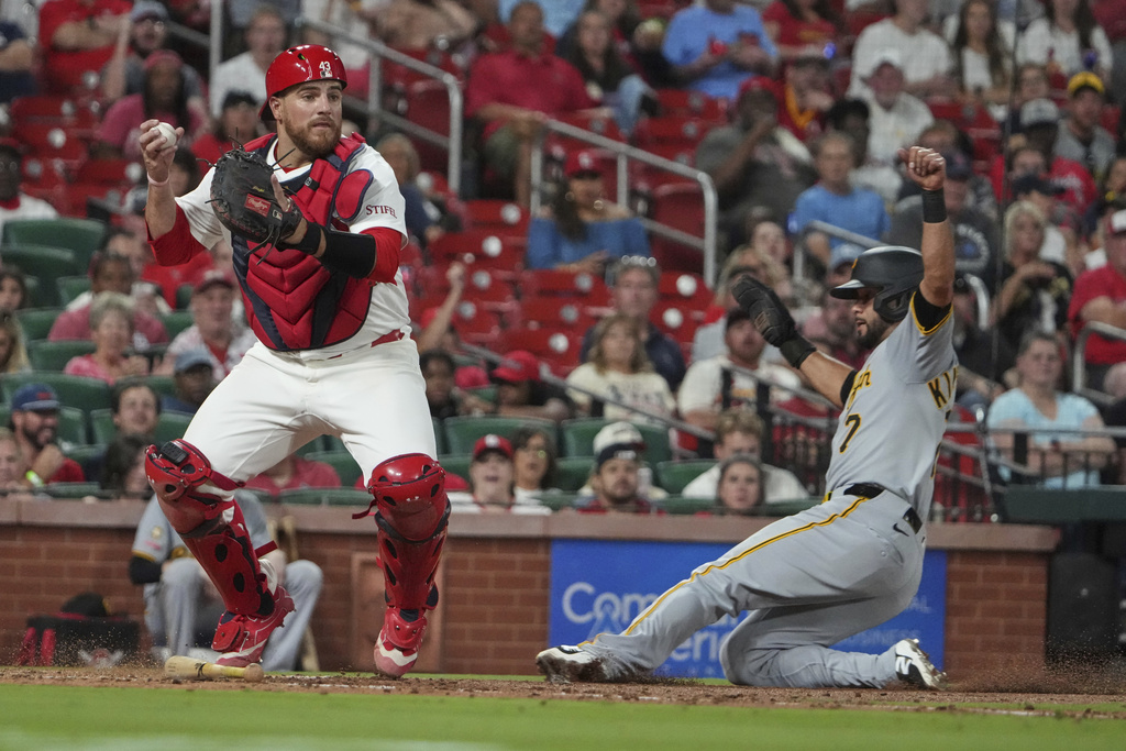 Pittsburgh Pirates' Isiah Kiner-Falefa (7) is forced out at home by St. Louis Cardinals catcher Pedro Pages during the sixth inning of a baseball game Wednesday, Aug. 27, 2025, in St. Louis. (AP Photo/Jeff Roberson)