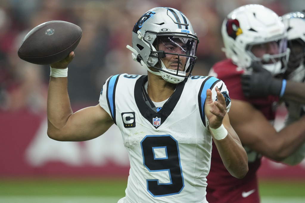 Carolina Panthers quarterback Bryce Young (9) throws against the Arizona Cardinals during the first half of an NFL football game, Sunday, Sept. 14, 2025, in Glendale, Ariz. (AP Photo/Ross D. Franklin)