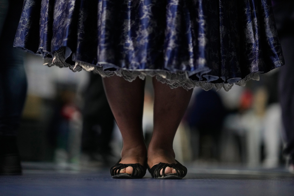 Catalina Cari queues at a polling station during a presidential runoff election in La Paz, Bolivia, Sunday, Oct. 19, 2025. (AP Photo/Natacha Pisarenko)