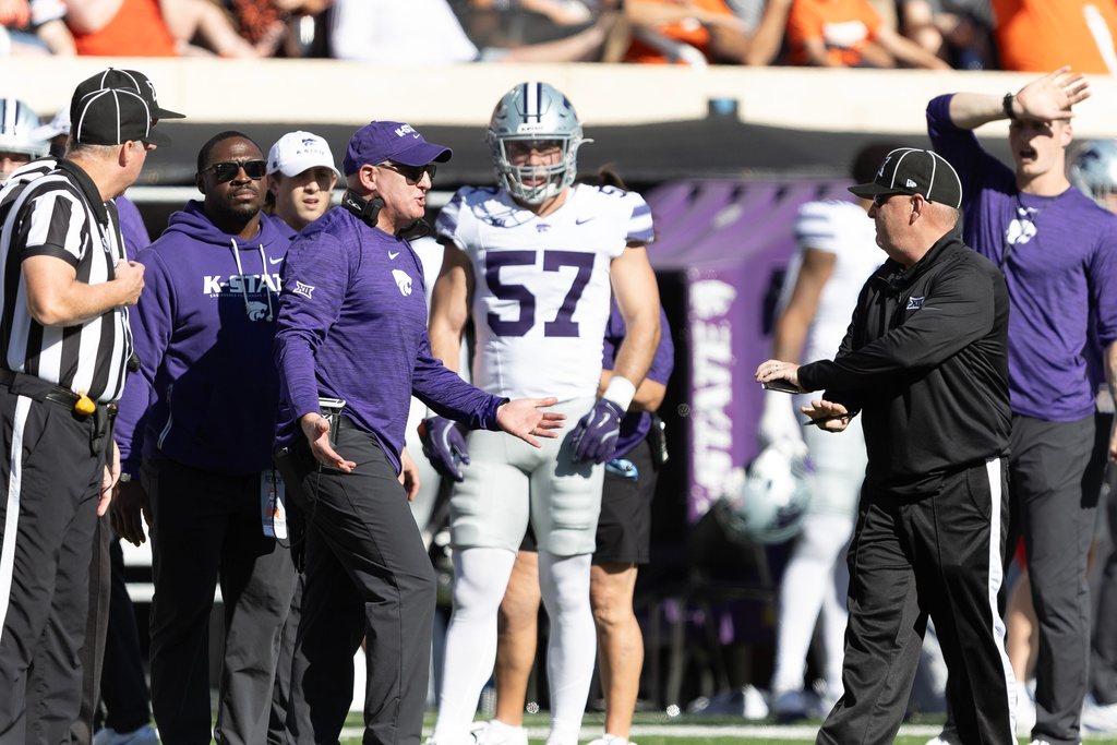 Kansas State head coach Chris Klieman talks to officials on the sidelines in the first half of an NCAA college football game against Oklahoma State Saturday, Nov. 15, 2025, in Stillwater, Okla. (AP Photo/Mitch Alcala)