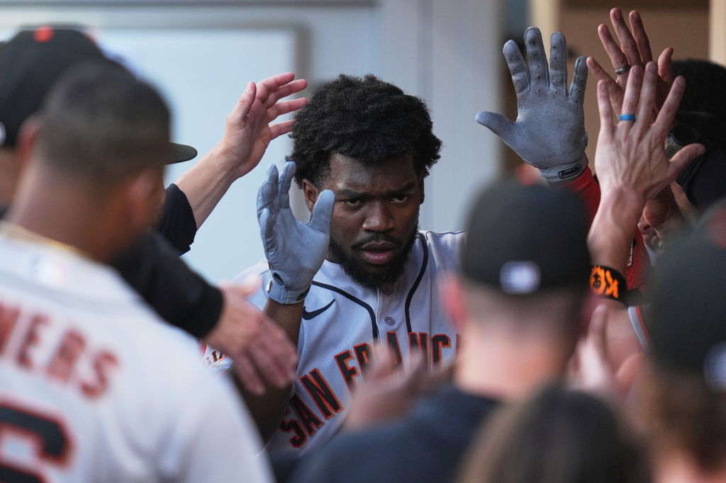 San Francisco Giants' Osleivis Basabe celebrates with teammates after hitting a two-run home run during the third inning of a baseball game against the San Diego Padres Saturday, Aug. 1, 2026, in San Diego. (AP Photo/Gregory Bull)