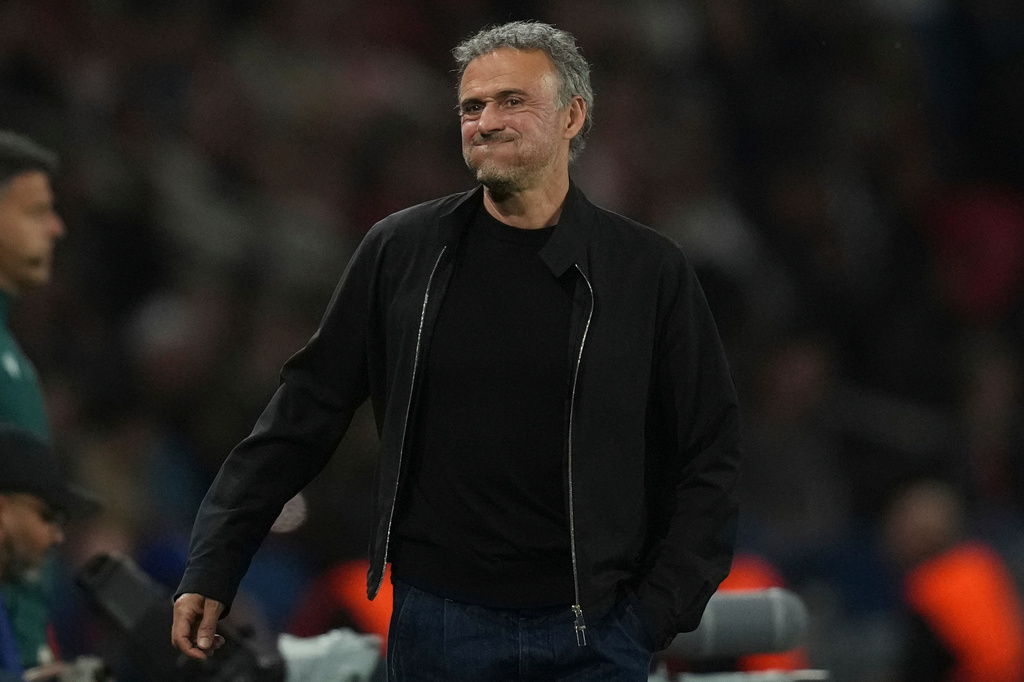 PSG's head coach Luis Enrique grimaces during the Champions League semifinal first leg soccer match between Paris Saint-Germain and Bayern Munich in Paris, Tuesday, April 28, 2026. (AP Photo/Christophe Ena)