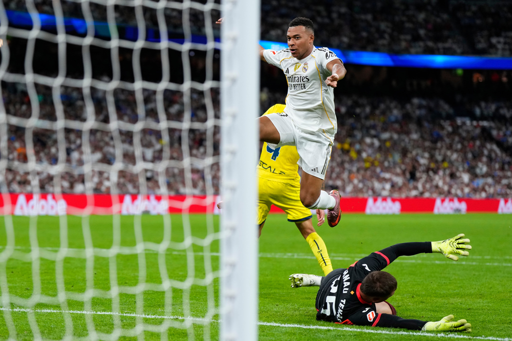 Real Madrid's Kylian Mbappe celebrates after scoring his side's third goal during the Spanish La Liga soccer match between Real Madrid and Villarreal at the Santiago Bernabeu stadium in Madrid, Spain, Saturday, Oct. 4, 2025. (AP Photo/Manu Fernandez)