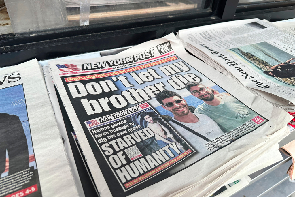 FILE - The New York Post is seen at a newsstand in Manhattan, Aug. 4, 2025. (AP Photo/Jennifer Peltz, File)