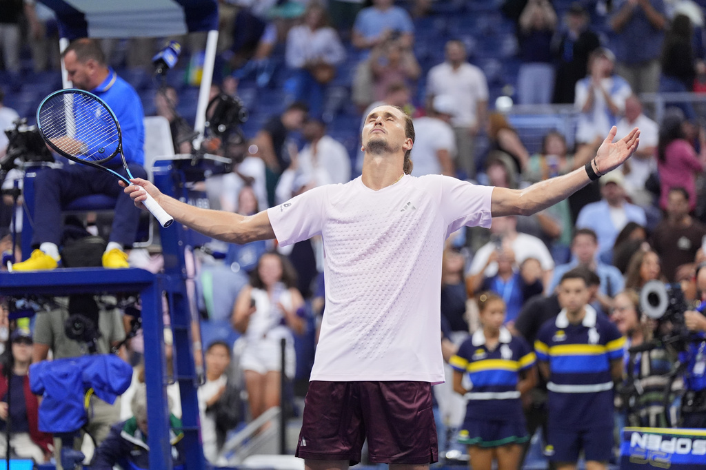 Alexander Zverev, of Germany, celebrates defeating Lorenzo Sonego, of Italy, in five sets In the first round of the U.S. Open tennis championships early Wednesday, Sept. 2, 2026, in New York. (AP Photo/Frank Franklin II)