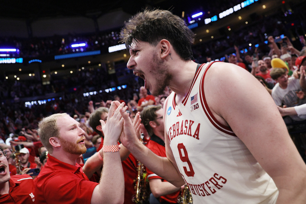 Nebraska forward Berke Buyuktuncel (9) celebrates with fans after a game against Vanderbilt in the second round of the NCAA college basketball tournament, Saturday, March 21, 2026, in Oklahoma City. (AP Photo/Nate Billings)