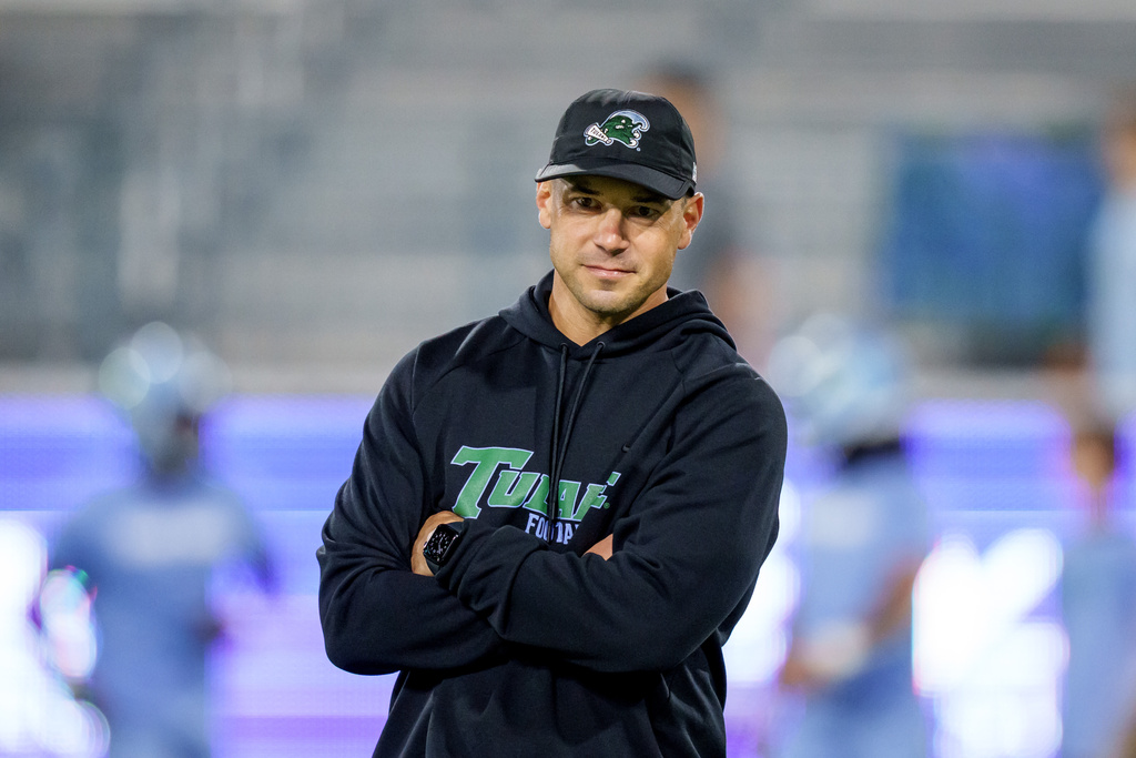 Tulane head coach Jon Sumrall watches his players before an NCAA college football game against Charlotte in New Orleans, Saturday, Nov. 29, 2025. (AP Photo/Matthew Hinton)
