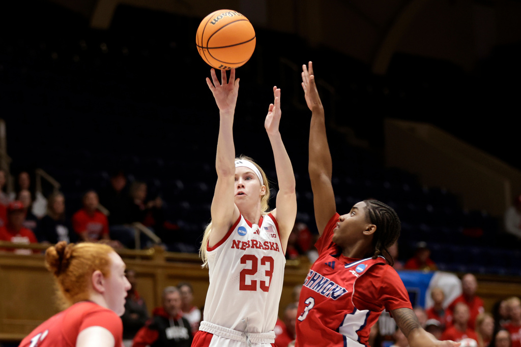 Nebraska guard Britt Prince (23) shoots againsty Richmond guard Alicia Newell (3) during the first half in a First Four college basketball game in the NCAA Tournament, Wednesday, March 18, 2026, in Durham, N.C. (AP Photo/Chris Seward)