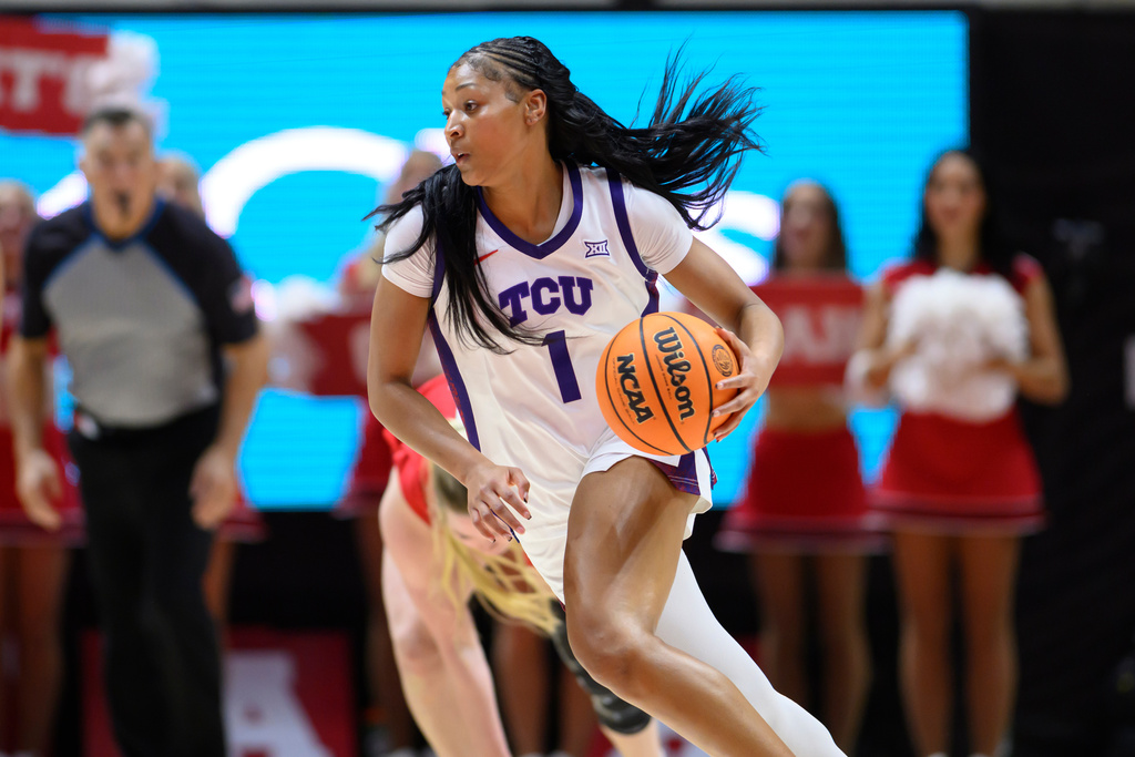 TCU guard Taylor Bigby (1) dribbles during the second half of an NCAA college basketball game against Utah, Saturday, Jan. 3, 2026, in Salt Lake City. (AP Photo/Tyler Tate)