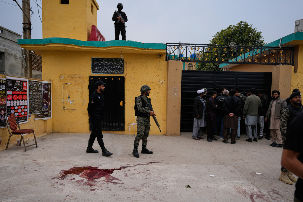 Pakistani paramilitary and police commandos take positions at the site of a bomb explosion at a Shiite mosque, in Islamabad, Pakistan, Friday, Feb. 6, 2026. (AP Photo/Anjum Naveed)