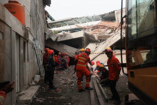 Rescuers search for victims after a building under construction collapsed, at an Islamic boarding school in Sidoarjo, East Java, Indonesia, Tuesday, Sept. 30, 2025. (AP Photo/Trisnadi) Rescuers search for victims after a building under construction collapsed, at an Islamic boarding school in Sidoarjo, East Java, Indonesia, Tuesday, Sept. 30, 2025. (AP Photo/Trisnadi)