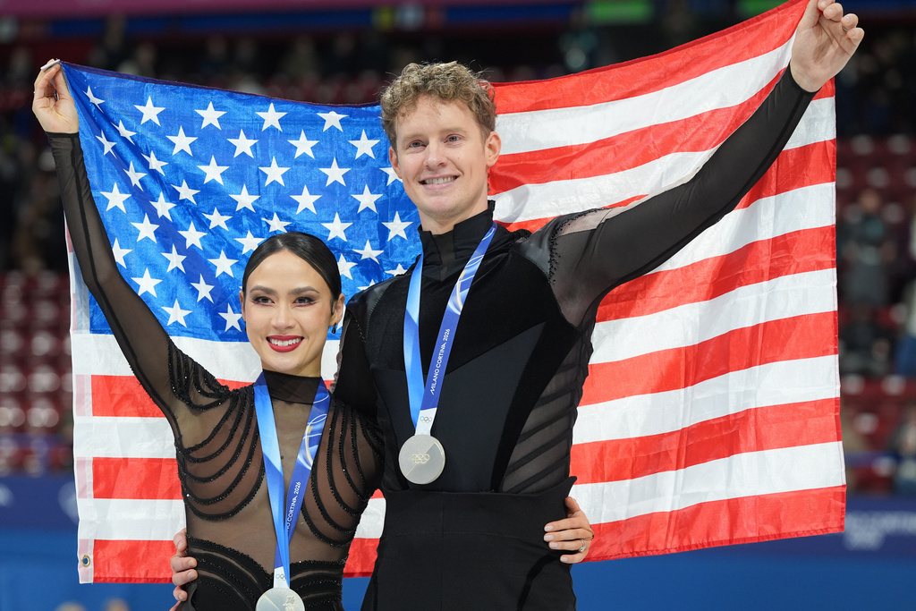 Silver medalists Madison Chock and Evan Bates of the United States pose with their medals after the ice dancing free skate in figure skating at the 2026 Winter Olympics, in Milan, Italy, Wednesday, Feb. 11, 2026. (AP Photo/Stephanie Scarbrough)
