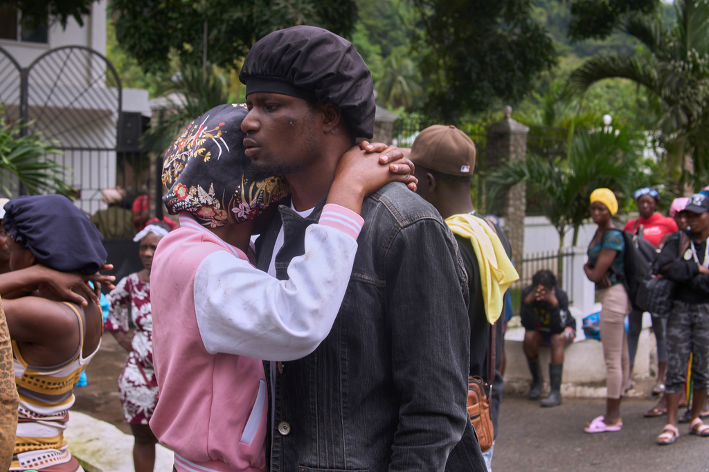 Relatives of a victim of a deadly stampede react in Milot, Haiti, Sunday, April 12, 2026. (AP Photo/Ketlain Difficile)